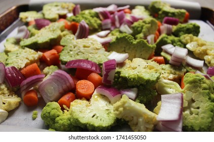 Veggies Close Up On A Oven Tray: romanesco cauliflower, red onion and carrots - Powered by Shutterstock