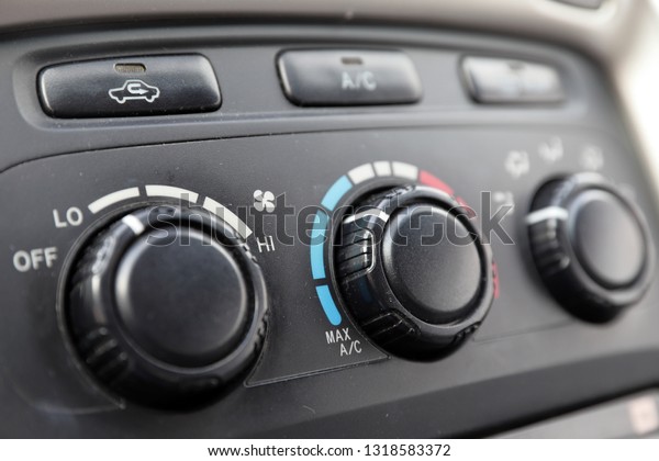 vehicle\
climate controls on dashboard of modern\
car