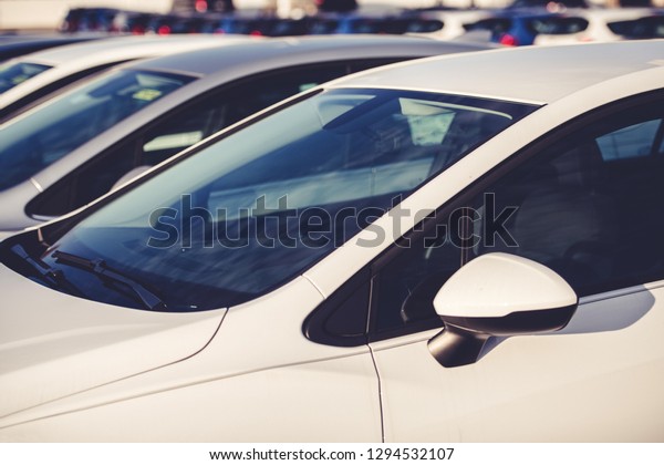 Vehicle Dealer Parking Lot. Brand New Cars\
Awaiting Customers. Automotive\
Industry.