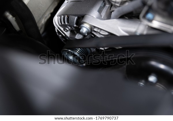 Vehicle\
electrical parts. Car alternator and fan\
belt.