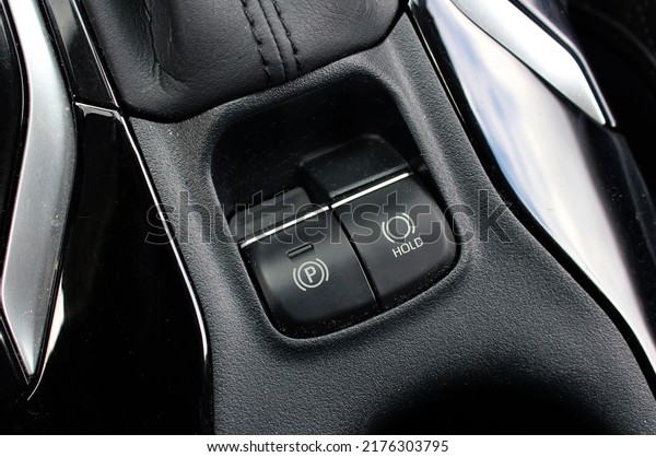 Vehicle interior of a\
modern car with Auto Hold electronic parking brake system.\
Electronic Hand brake. 