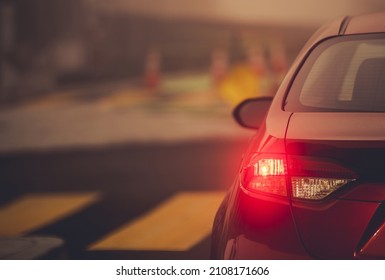 Vehicle Left Turn Signal On A Road Intersection Close Up. Safety Driving Theme.