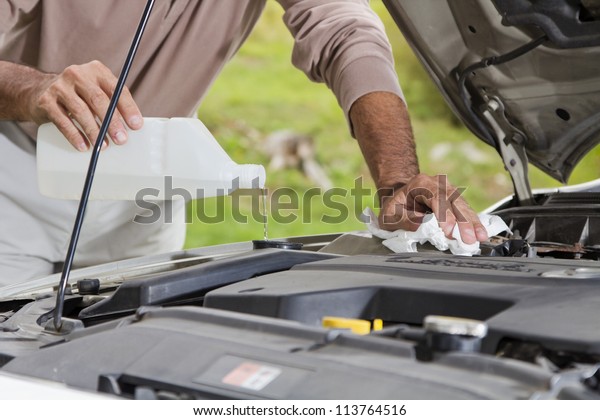 Vehicle maintenance - Filling the windshield washer\
fluid on a Car