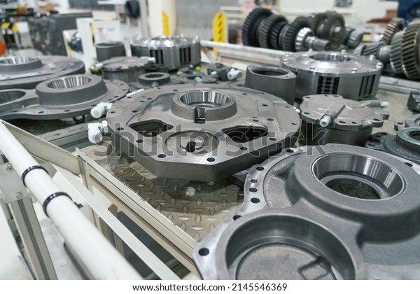 Vehicle metal parts in factory. Production line\
for assembly industrial\
tractors