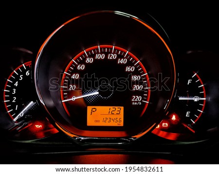 Vehicle miles 123456 kilometer. 
Gear is in the parking position. Time is after 1 o'clock, 23 minutes.