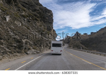 Vehicle moving on the road between mountain captured circa September 2016