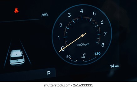 Vehicle is parked. Detailed close up view of speedometer, front panel.