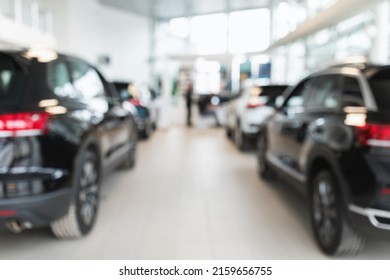 Vehicle purchase, rental, lease concept. Blurred view of automobile dealership store interior with new modern cars, copy space. Luxury showroom store with cars for sale, defocused shot - Shutterstock ID 2159656755