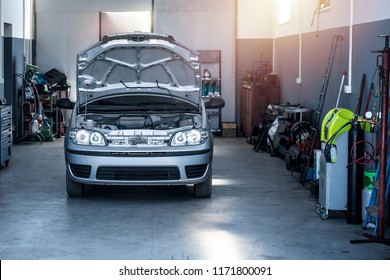 Vehicle repair shop with car and tools. Car service. - Shutterstock ID 1171800091