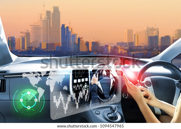 vehicle running self\
driving mode electric car or intelligent car.Heads up\
display(HUD).futuristic vehicle and graphical user\
interface(GUI).self-driving mode\
