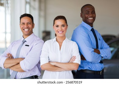 Vehicle Sales Team With Arms Crossed Inside Car Showroom