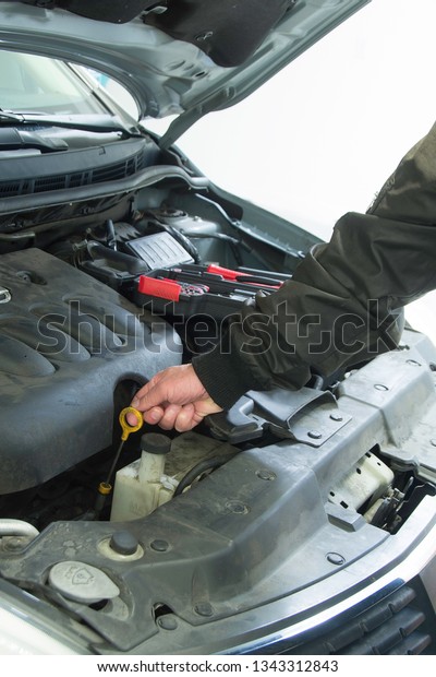 Vehicle\
is in a shop for repair and periodic\
maintenance