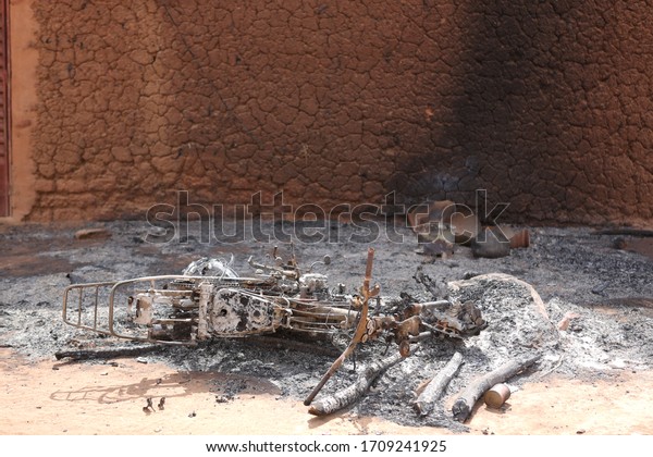 vehicle\
shot in war in Mali. burnt out motorcycle\
image