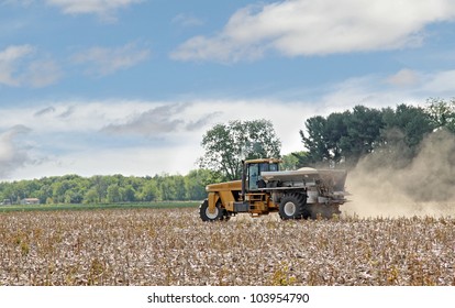 Vehicle Spreading Lime Fertilizer Onto A Farm Field