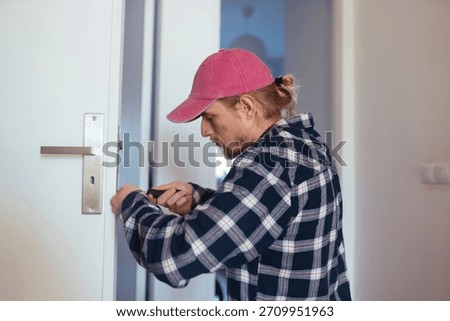 Vehicle technician diagnosing engine problems at curbside location