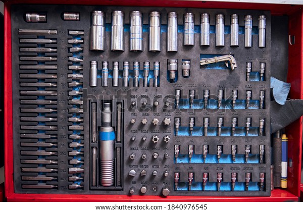 Vehicle tool box or auto repair kit with\
stainless steel sockets and screwdriver\
bits