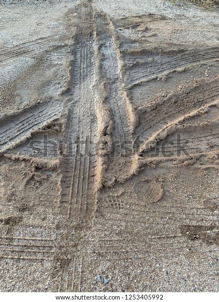 Vehicle tracks in the\
mud