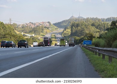 vehicle traffic on the Bandeirantes highway towards the city of São Paulo, border with the city of Caieiras, SP, Brazil, Pico do Jaraguá in the background