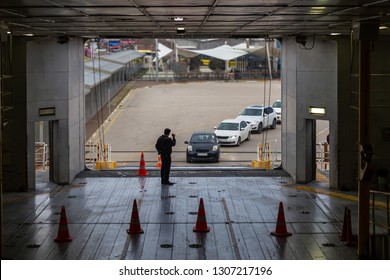 Vehicles Being Loaded On Car Ferry