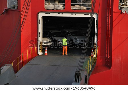 Vehicles carrier ramp is ready for unloading car vehicles on the harbour berth
