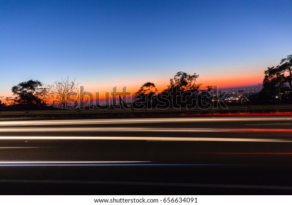 Vehicles Lights Dawn\
Speed Blurs\
Vehicles cars lights speed blurs dawn traveling\
traffic motion colors.