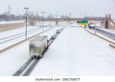 Vehicles travel on a snow packed interstate in Oklahoma City. 