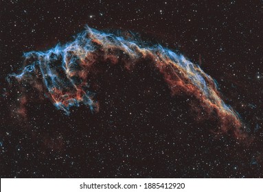 The Veil Nebula is a supernovae remnant cloud of heated and ionized gas and dust in the constellation Cygnus