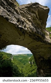 The Veja bridge is a natural rock arch that has inspired artists and poets such as Andrea Mantegna and Dante Alighieri. Lessinia, Italy.