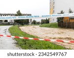 Velenje  Slovenia - August 04 2023: Severe flooding and water damage to city areas in Slovenia due to heavy rain and severe weather conditions with police, ambulance and civil duty tape