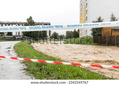 Velenje  Slovenia - August 04 2023: Severe flooding and water damage to city areas in Slovenia due to heavy rain and severe weather conditions with police, ambulance and civil duty tape