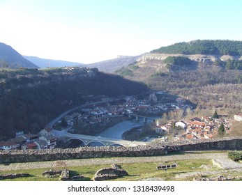 Veliko Tarnovo, Bulgaria - February 2018: Panoramic View Of Mountains And Asenovo, The Suburb In The Valley Of Yantra River, In The Sunny Evening