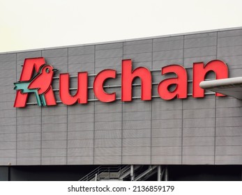 Velizy, France - MARCH 17 2022 : Auchan Hyper Market Brand Outside Facade