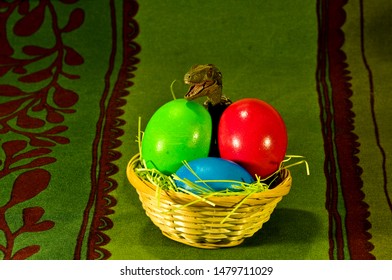 Velociraptor Near Colourful Easter Eggs On Table