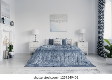 Velvet Blue Duvet On King Size Bed In Elegant New York Bedroom With White Furniture