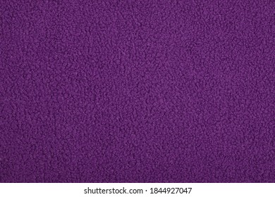 velvet, violet purple Abstract Artificial texture fur fabric, background, closeup. Fluffy material backdrop, kids toys faux fur.