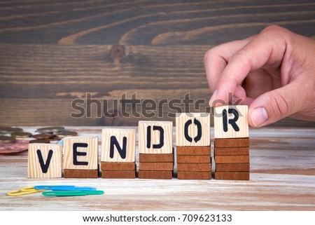 Vendor concept. Wooden letters on the office desk, informative and communication background