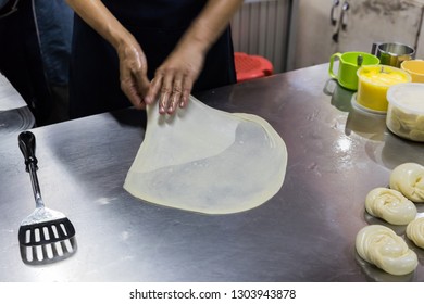 Vendor Making Roti, Round Flatbread India Food, By Flipping And Slap Bread On The Stainless Table Before Fried On Hot Oily Pan, Thai Street Food, Hand Moving Motion