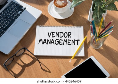 Vendor management open book on table and coffee Business - Shutterstock ID 445246459
