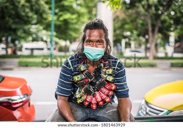 The\
vendor sold a car made out of cans and hung on his neck Chatuchak\
Weekend Market Bangkok, Thailand, August 22,\
2020