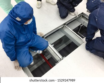 Vendor Working At Raised Floor At Clean Room