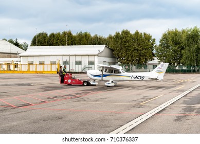 Venegono Inferiore, Varese, Italy - September 02, 2017: Workers moving Cessna 172 SP Aircraft to hangar, is the fleet of AeroClub of Varese.