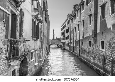 Venetian canal Rio de la Pleto. Old walls with balcony and architecturical elements. Venice, Veneto, Italy. Black and white photography. - Powered by Shutterstock