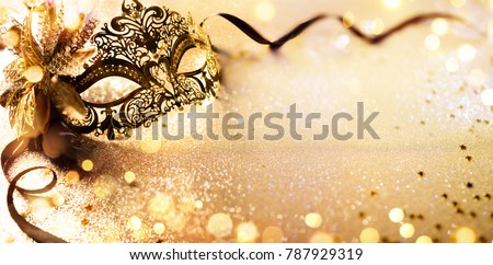 Venetian Golden Mask On Shiny Defocused Background