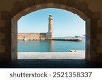 Venetian Lighthouse in Rethymno, Crete, Greece. Old lighthouse with the sea in the background