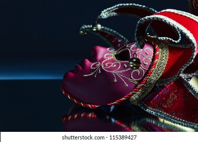 The Venetian Mask With Bells On A Mirror Table