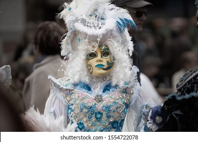 Venetian mask. Day of the Graff of May. Venetian mask. People in festival costume with mask at Venice carnival in Italy. Carnival costumes and masks Venice