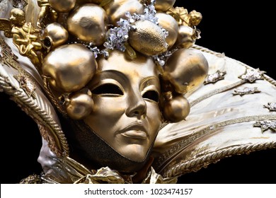 venetian mask with gold leaf, Traditional carnival venetian mask, Beautiful young woman in mysterious colors Venetian mask. Fashion photo. Holidays and celebrations . Party fantasy woman  - Powered by Shutterstock