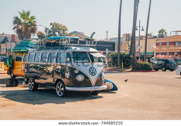 Venice beach, Los Angeles USA - March 15, 2015: A\
classic Volkswagen Van full with surf boards parked at the Venice\
beach in Los Angeles. 
