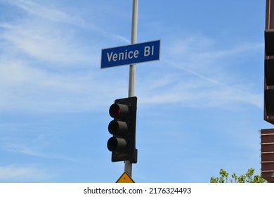 Venice Boulevard street sign and red street light