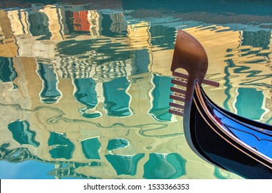 Venice Gondola And Reflection Of Buildings In Water,Venice,Italy